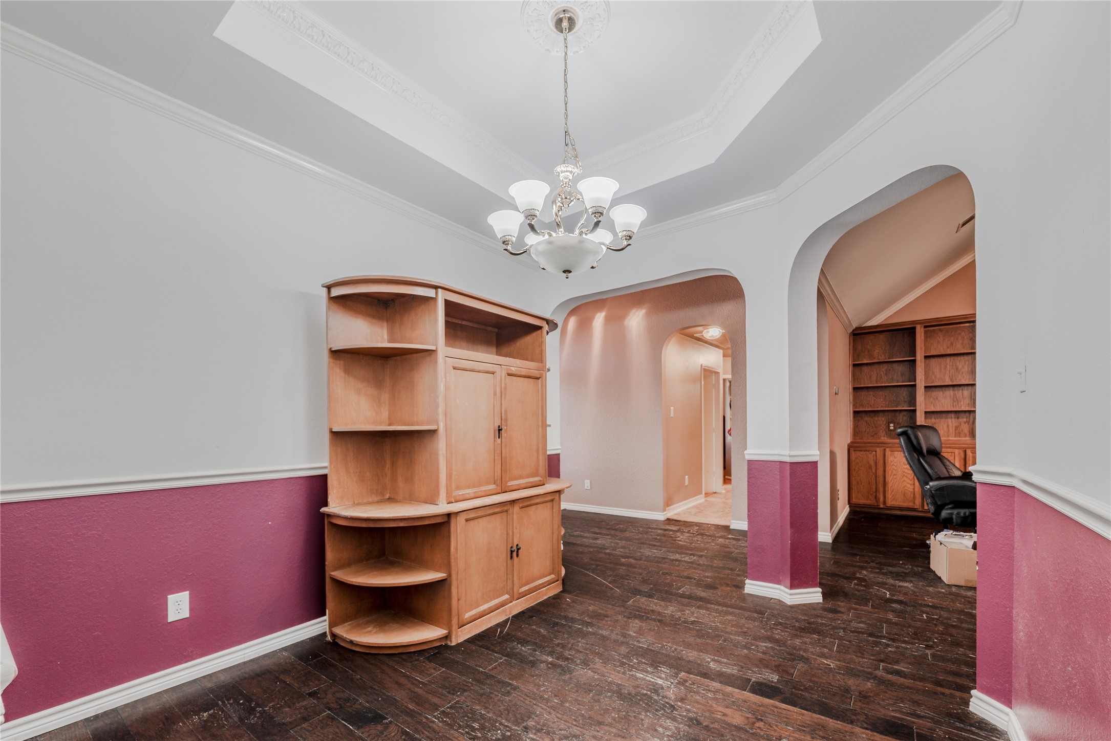 7714 Broken Arrow Street Baytown, TX 77521 - Photo 7 of 41 a living room with furniture and a chandelier