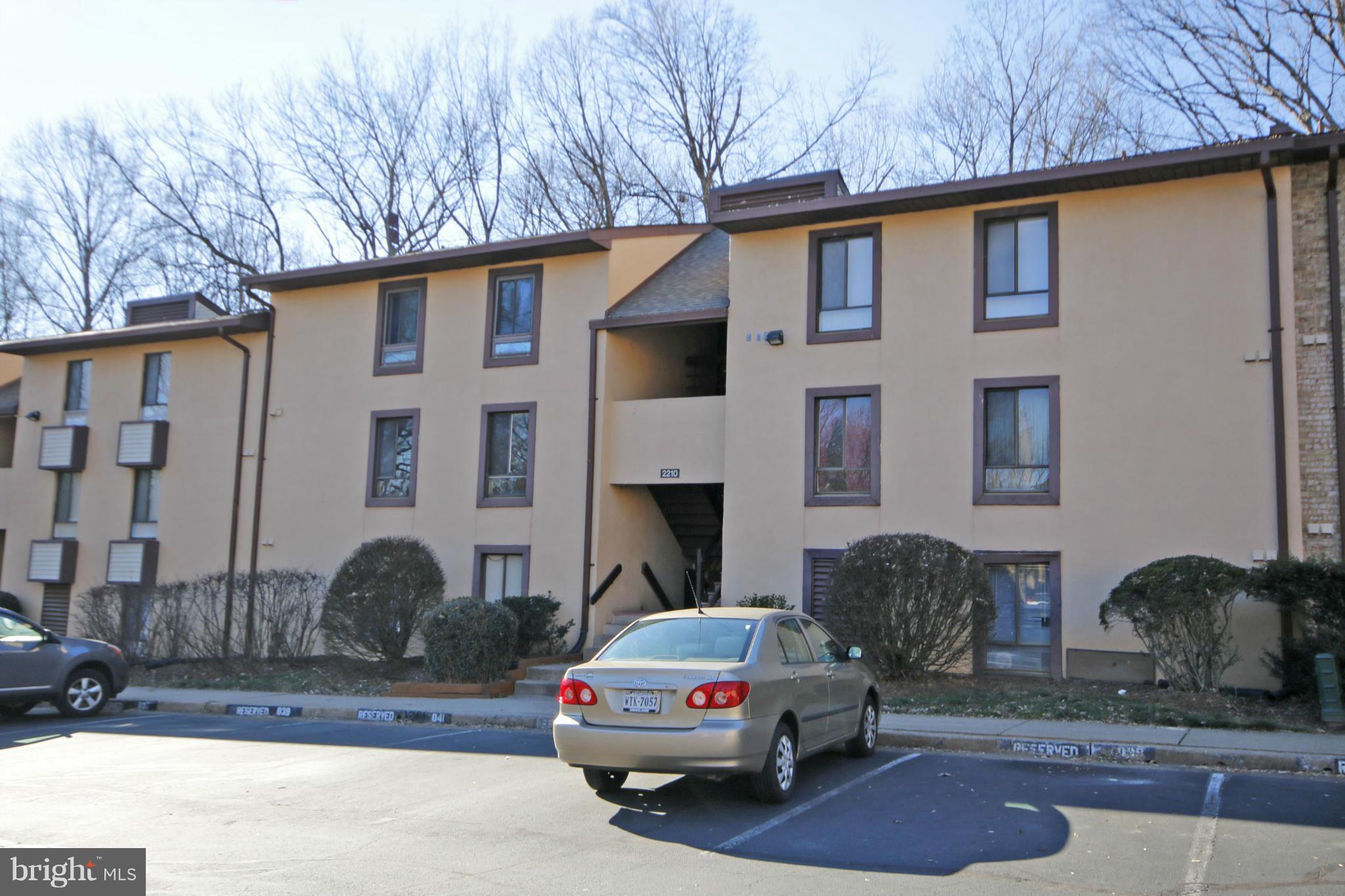 2210 Castle Rock Square, Unit 1B Reston, VA 20191 - Photo 2 of 26 a car parked in front of a house