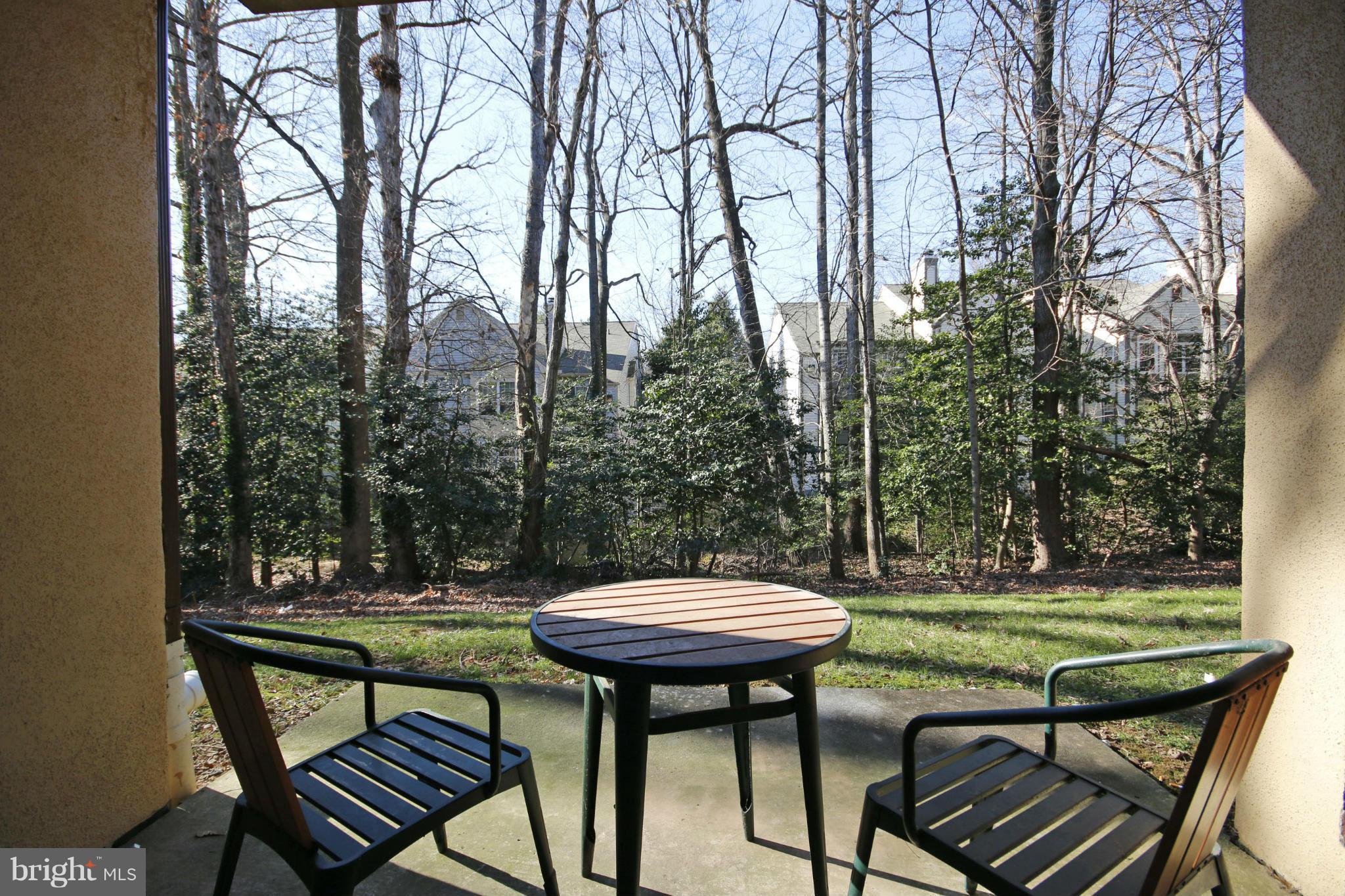2210 Castle Rock Square, Unit 1B Reston, VA 20191 - Photo 21 of 26 a view of a chairs in a backyard