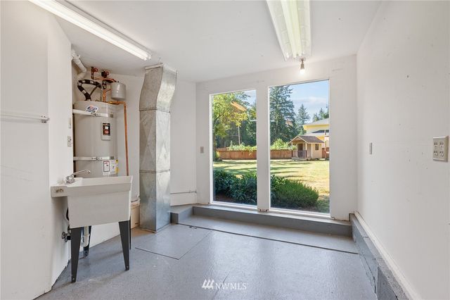 a view of livingroom with furniture window and front door