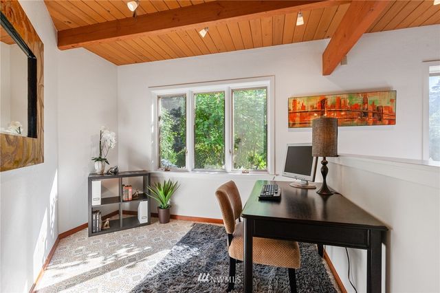 a workspace with furniture and a window