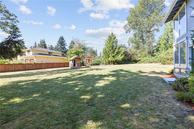 a view of a street with a building in the background