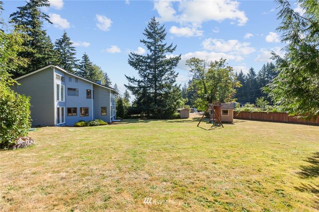 a view of a swimming pool with a yard