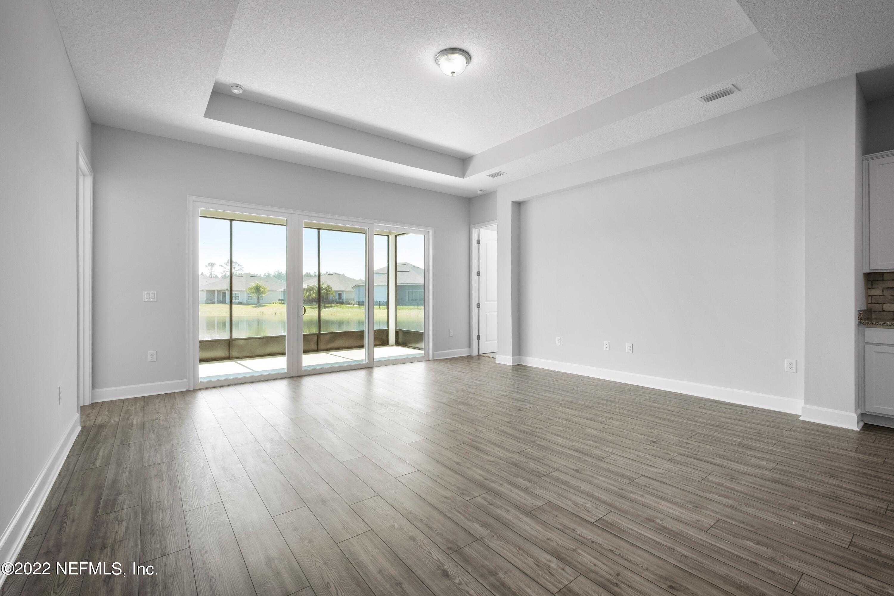 160 Daniel Creek Court St. Augustine, FL 32095 - Photo 15 of 35 a view of an empty room with wooden floor and a window