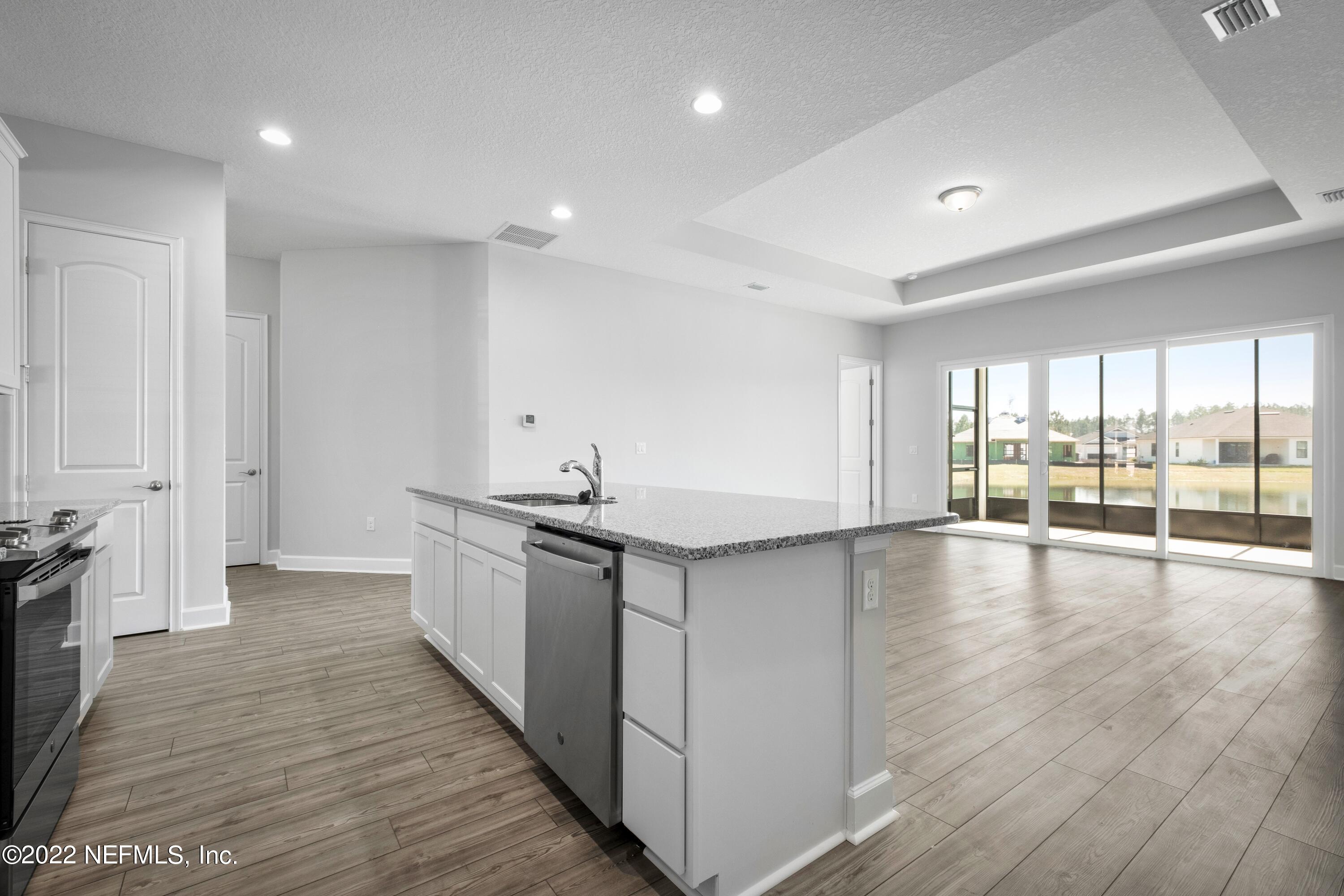 160 Daniel Creek Court St. Augustine, FL 32095 - Photo 19 of 35 a view of a kitchen with a sink and wooden floor