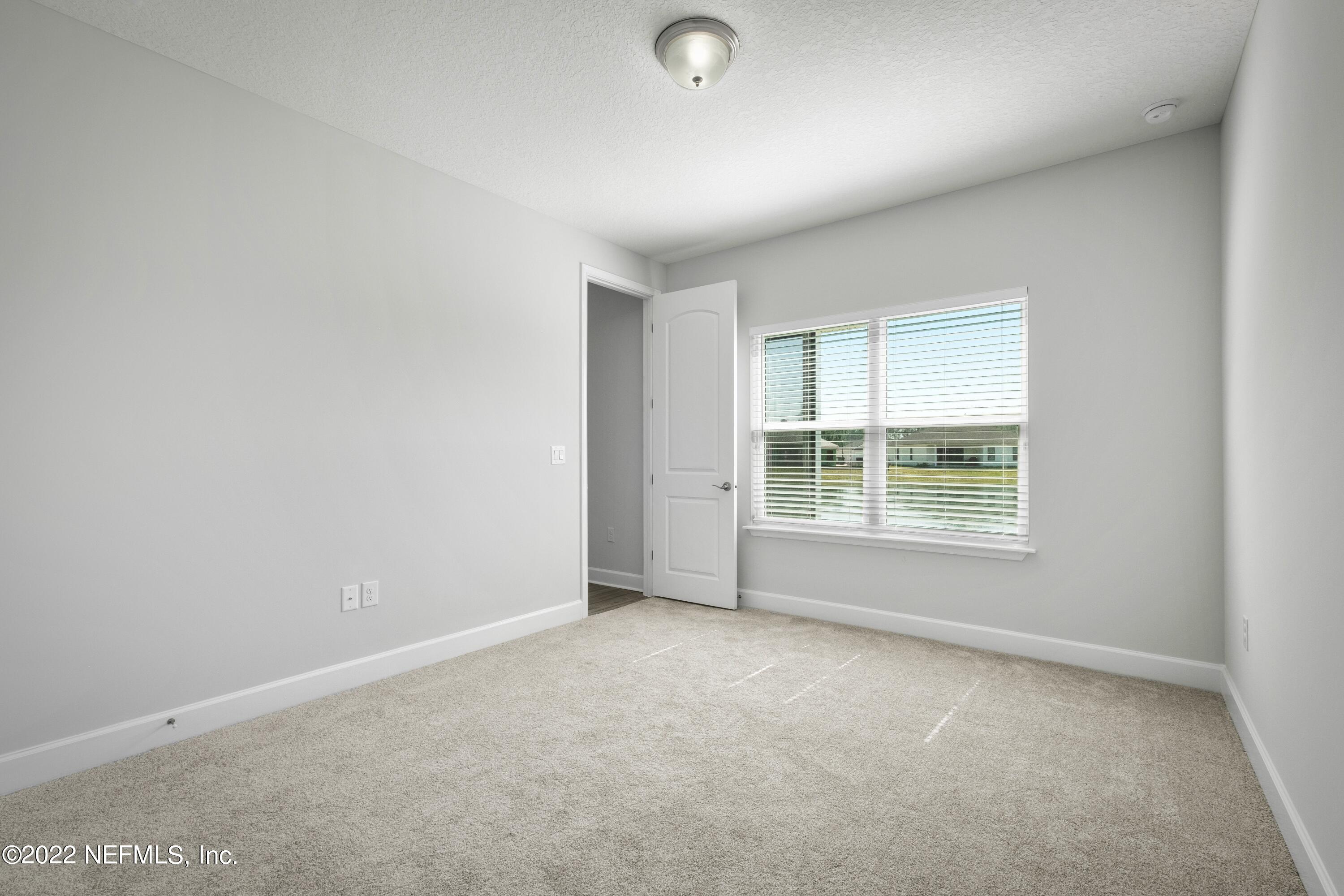 160 Daniel Creek Court St. Augustine, FL 32095 - Photo 24 of 35 an empty room with a window