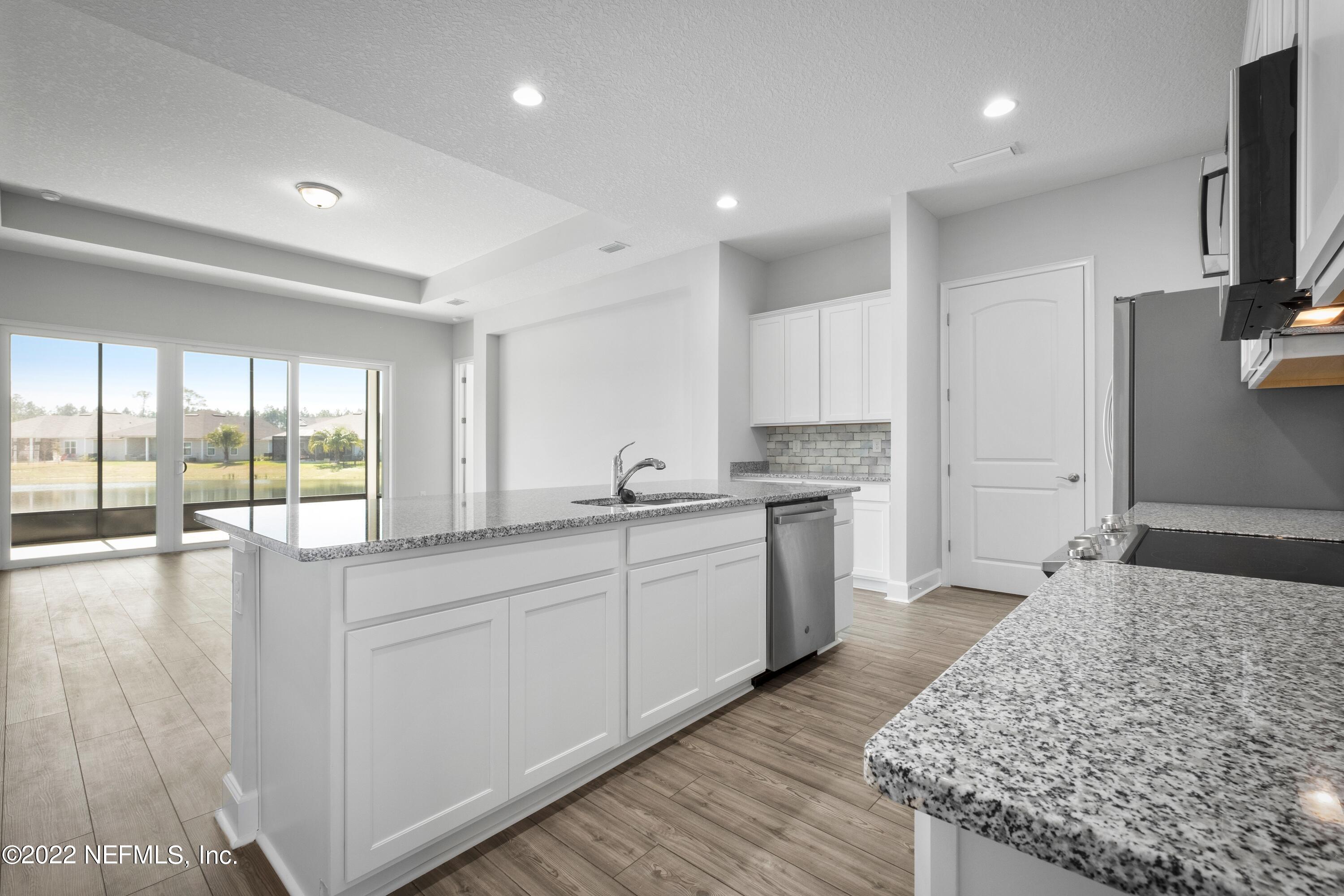 160 Daniel Creek Court St. Augustine, FL 32095 - Photo 4 of 35 a large white kitchen with a large window