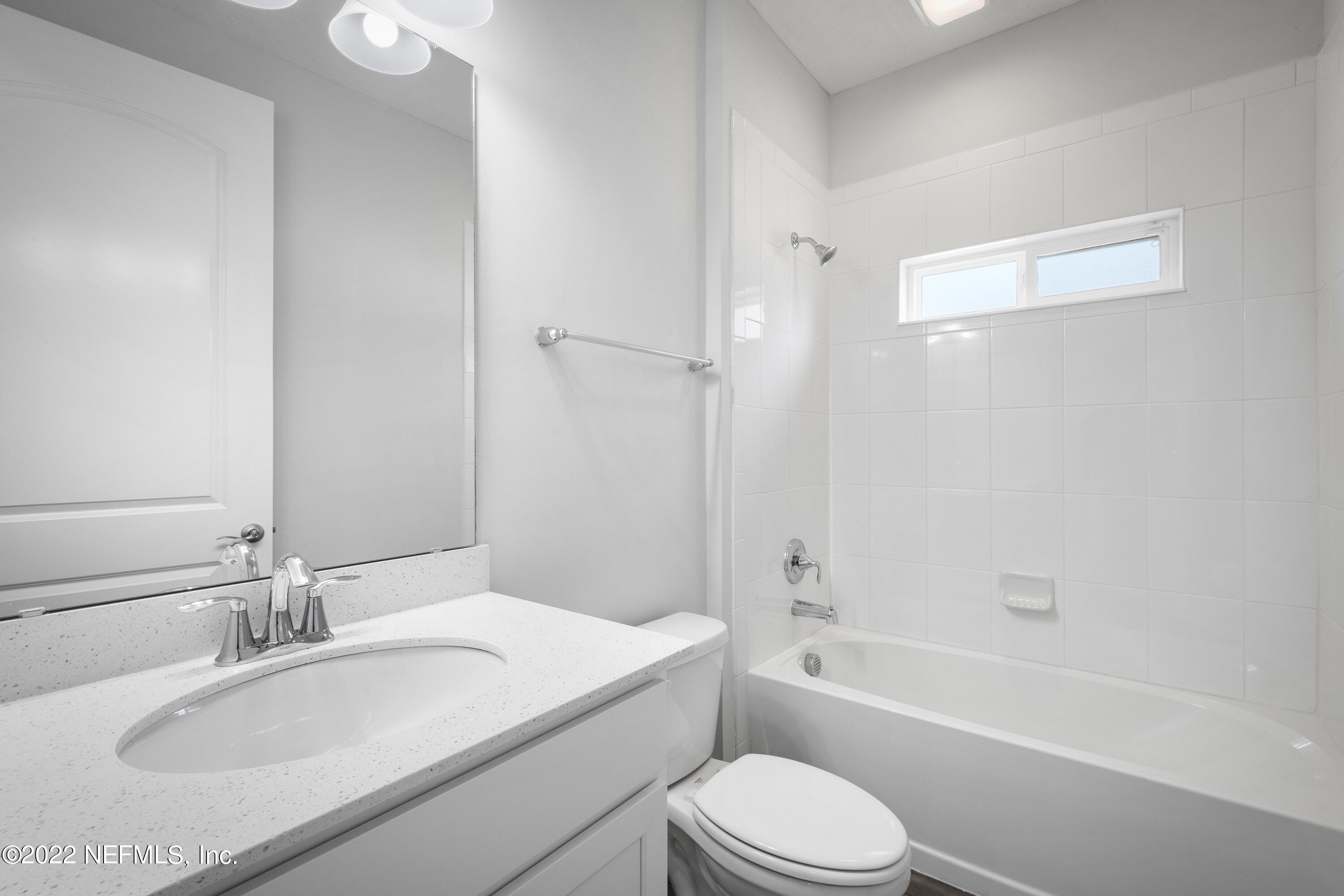 160 Daniel Creek Court St. Augustine, FL 32095 - Photo 10 of 35 a bathroom with a granite countertop sink toilet tub and shower