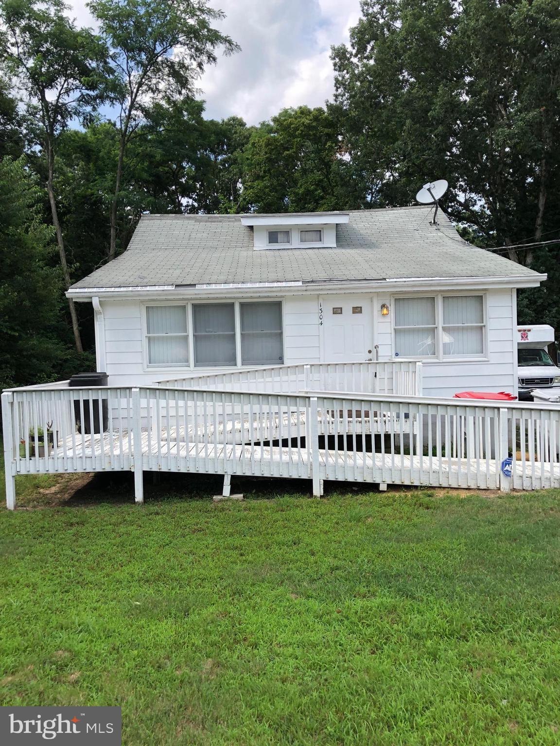 1304 Garrison Road Vineland, NJ 08360 - Photo 1 of 36 a view of a house with a backyard and garden
