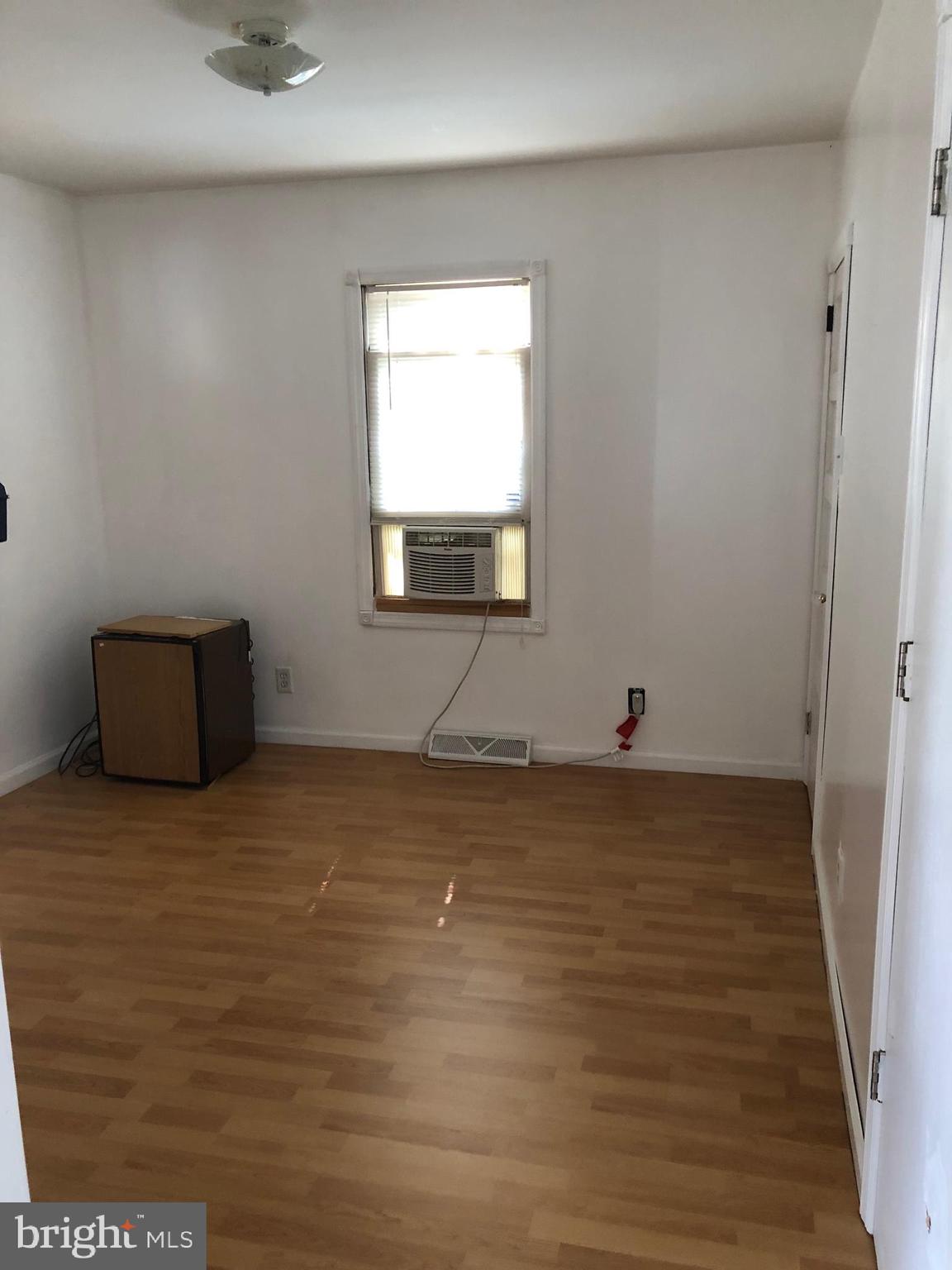 1304 Garrison Road Vineland, NJ 08360 - Photo 13 of 36 a view of a room with wooden floor and window