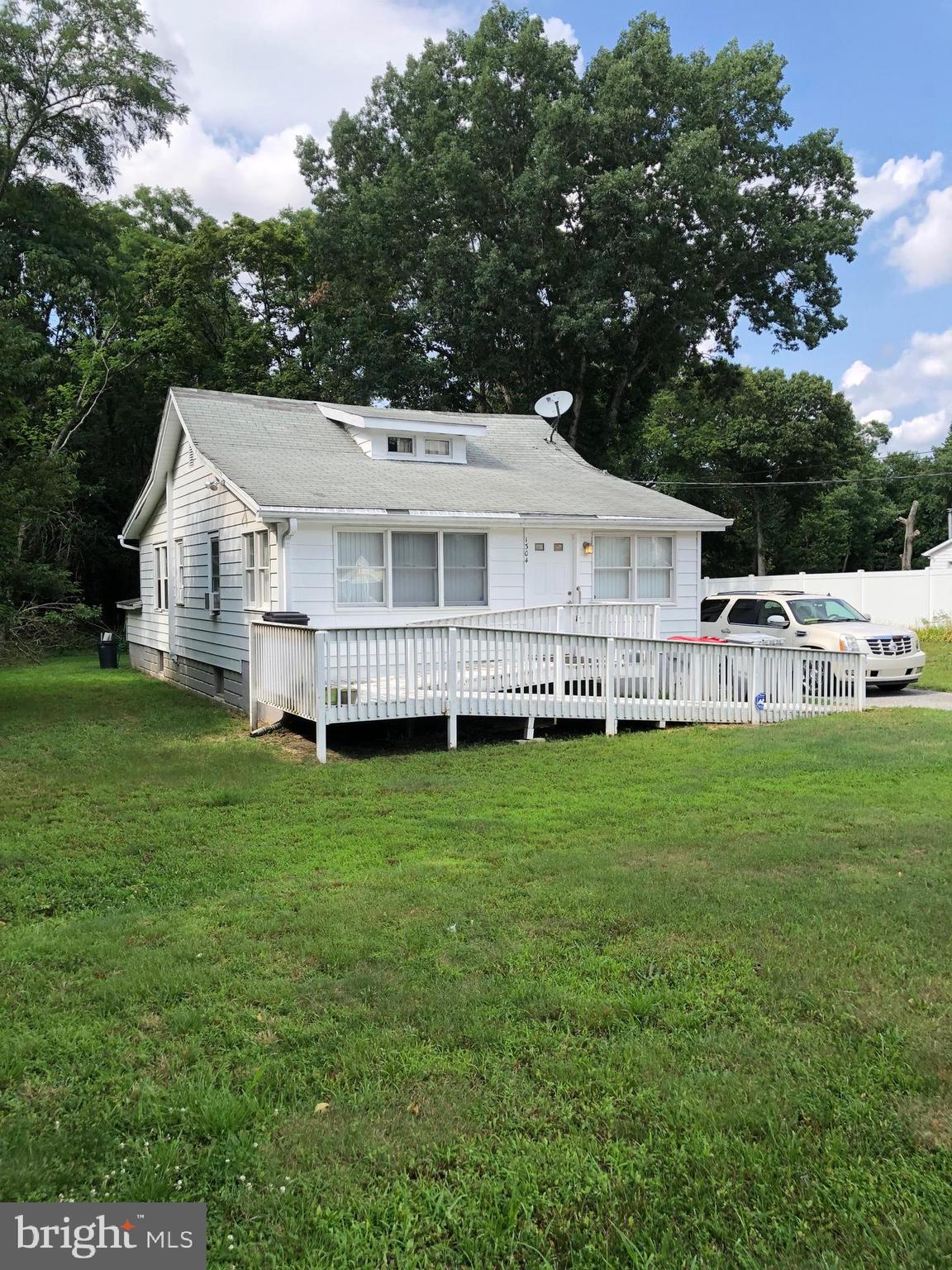 1304 Garrison Road Vineland, NJ 08360 - Photo 3 of 36 a view of a house with a big yard and large trees
