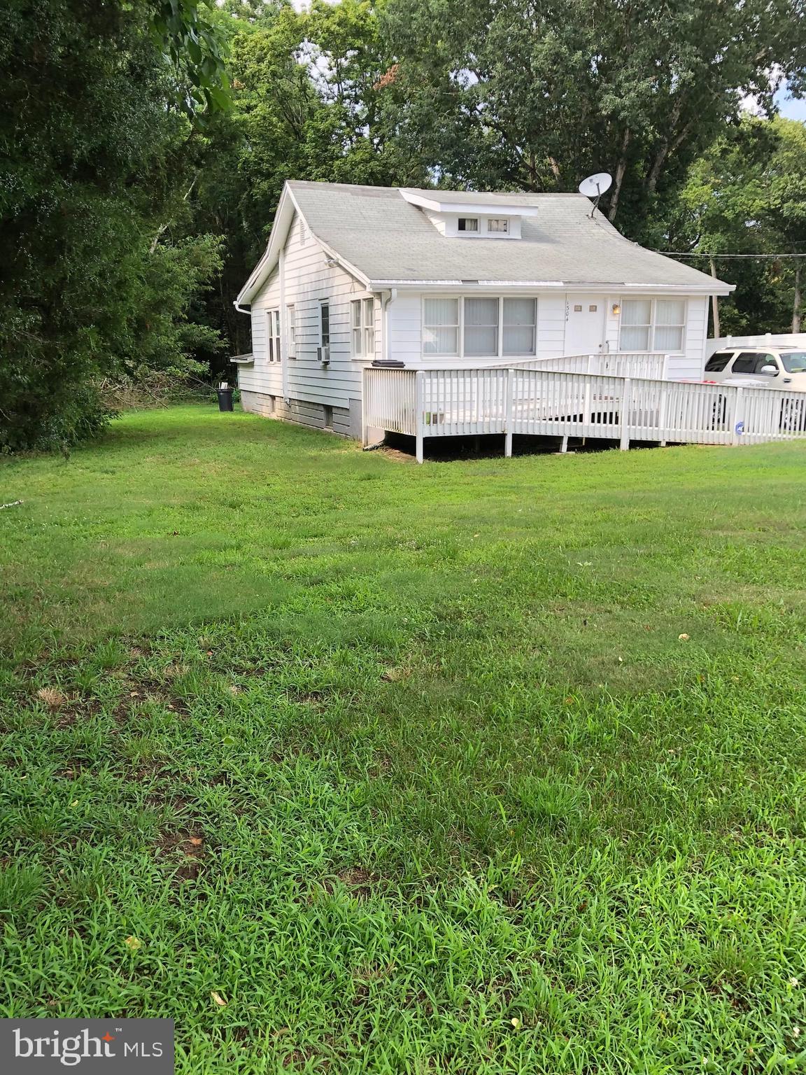 1304 Garrison Road Vineland, NJ 08360 - Photo 21 of 36 a view of a house with a yard and sitting area