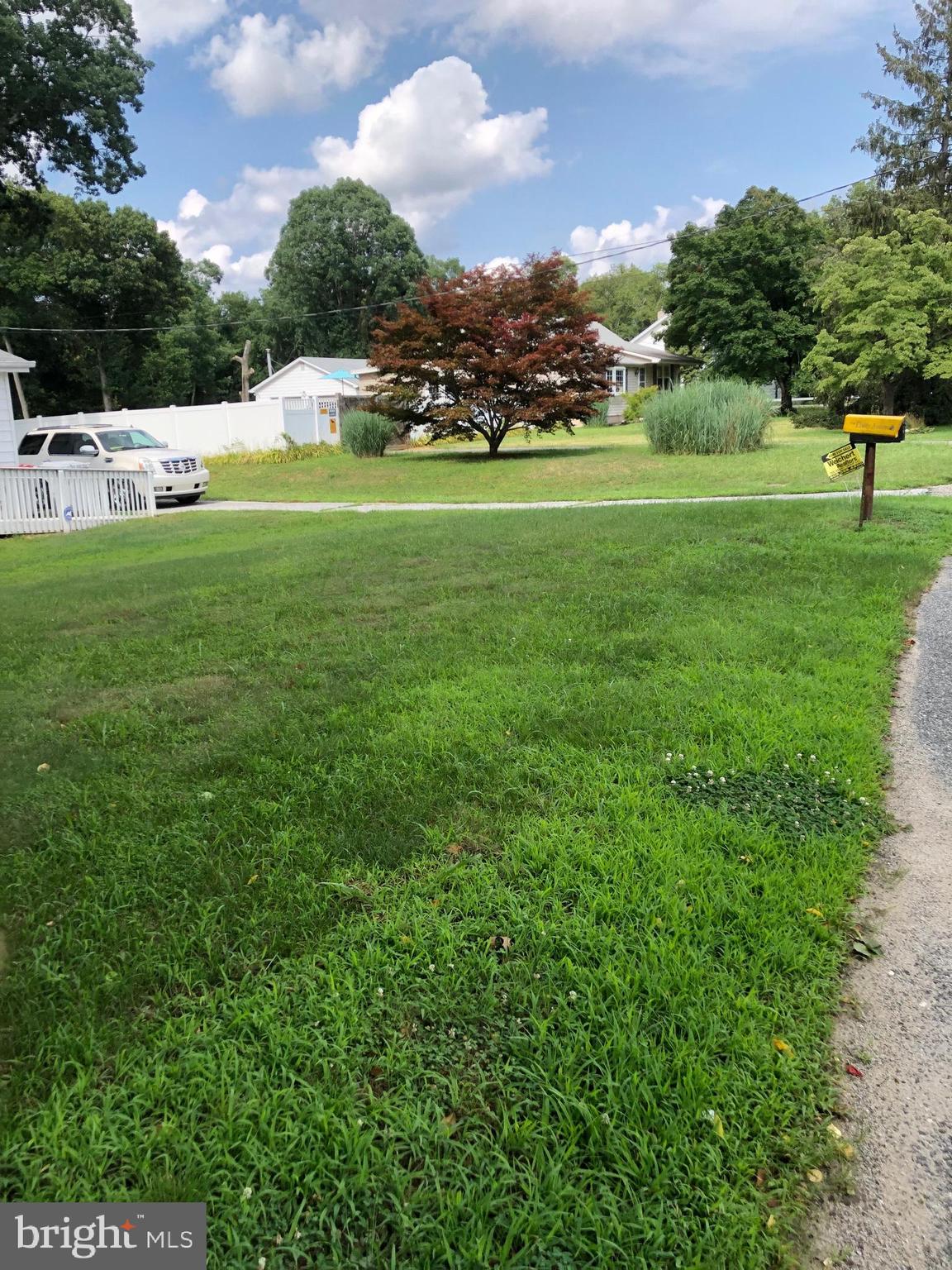 1304 Garrison Road Vineland, NJ 08360 - Photo 23 of 36 a view of a big yard with a house in the background