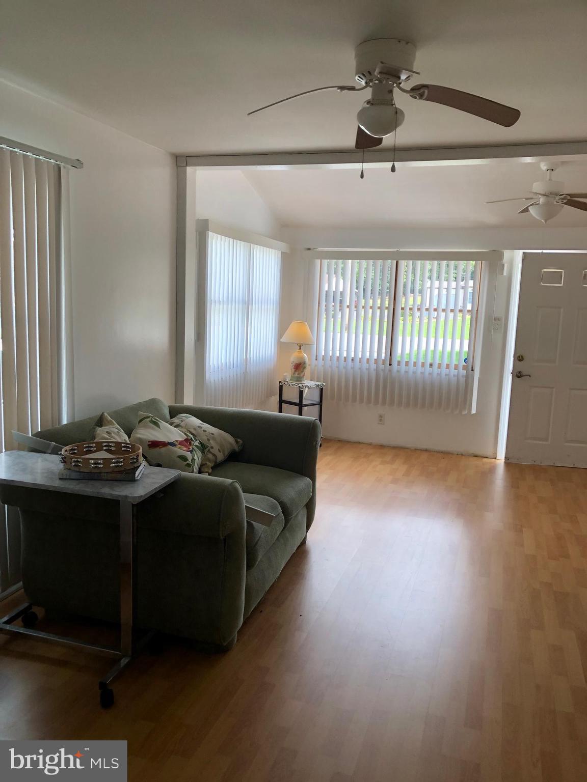 1304 Garrison Road Vineland, NJ 08360 - Photo 35 of 36 a living room with a couch and a wooden floor