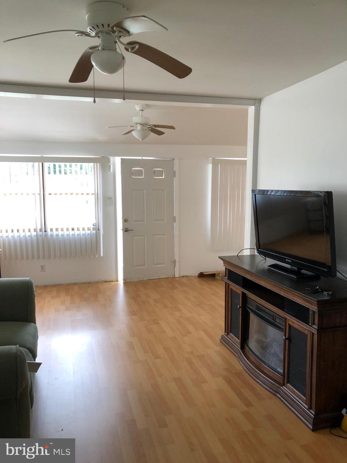 1304 Garrison Road Vineland, NJ 08360 - Photo 10 of 36 a living room with furniture and a flat screen tv