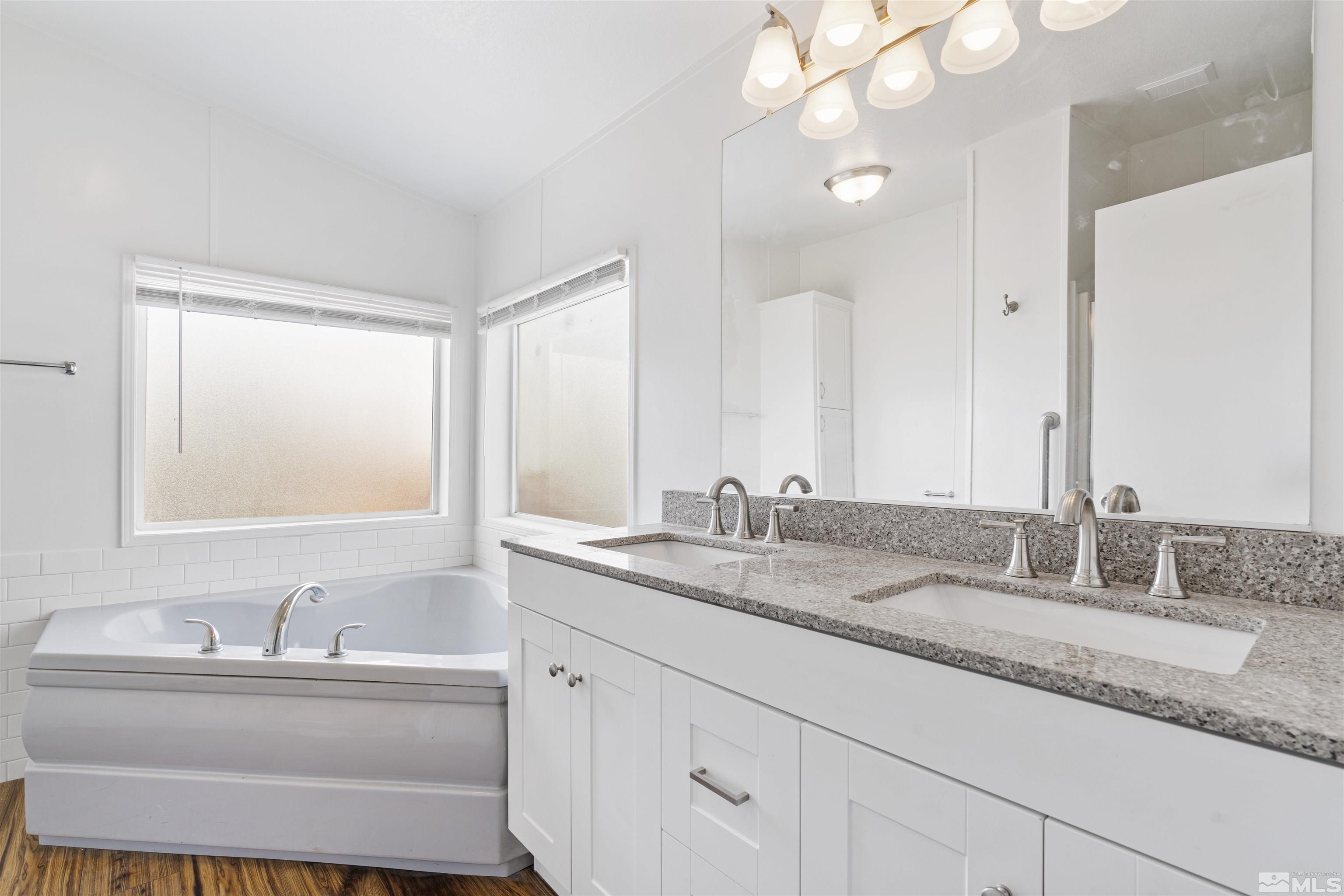 16000 Perlite Drive Reno, NV 89521 - Photo 12 of 29 a bathroom with a granite countertop sink mirror and double