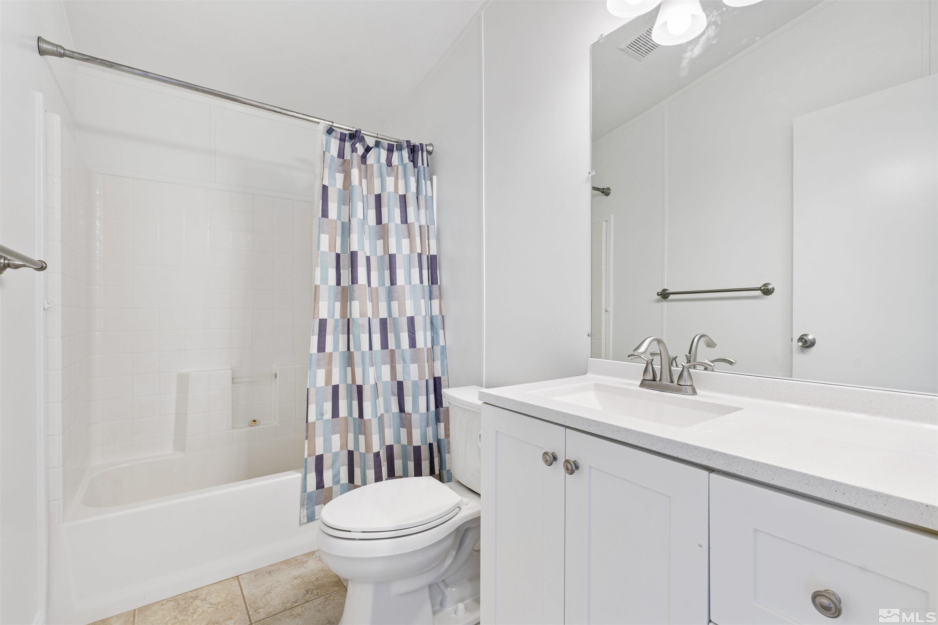 16000 Perlite Drive Reno, NV 89521 - Photo 14 of 29 a bathroom with a sink toilet and shower