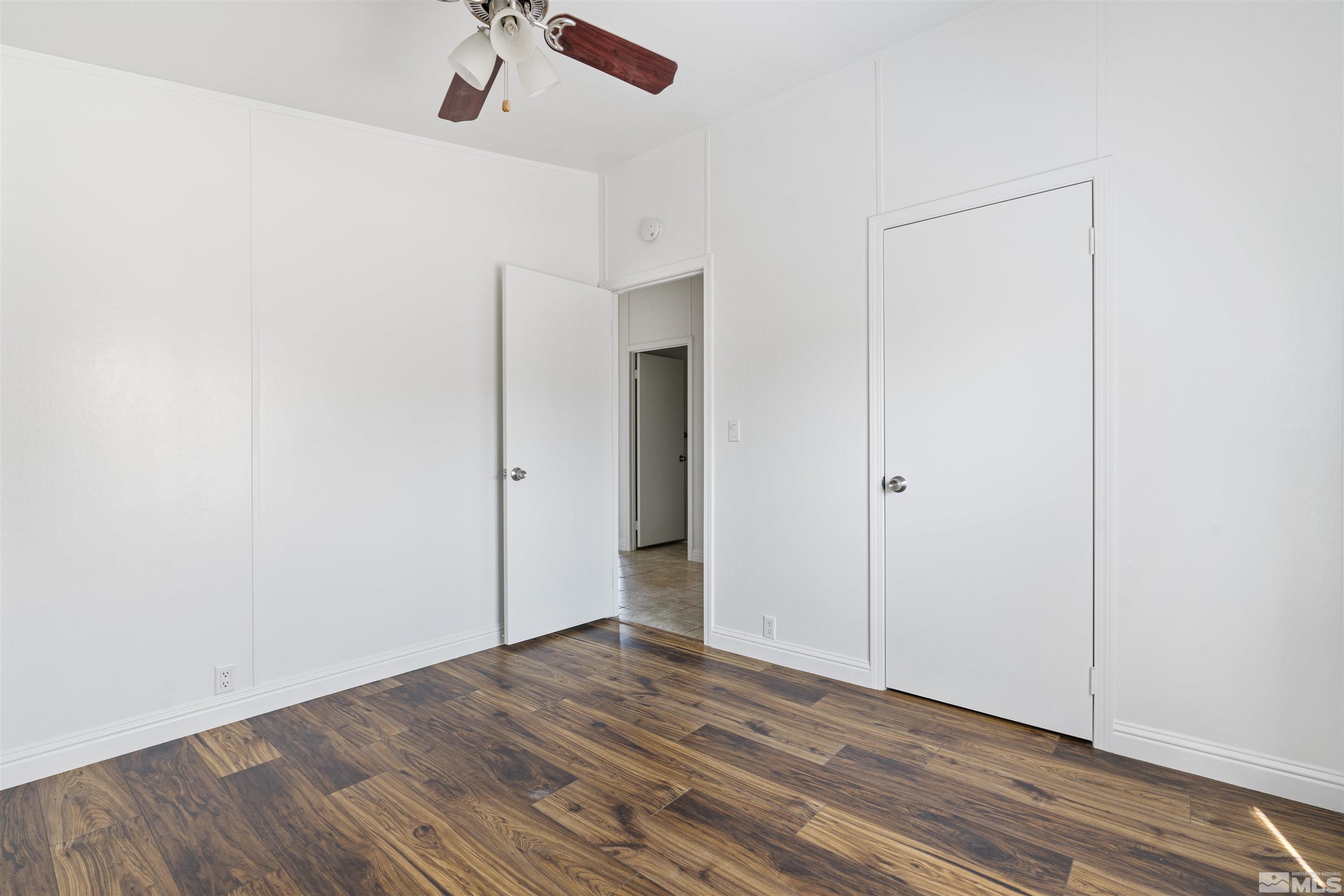 16000 Perlite Drive Reno, NV 89521 - Photo 18 of 29 a view of empty room with wooden floor