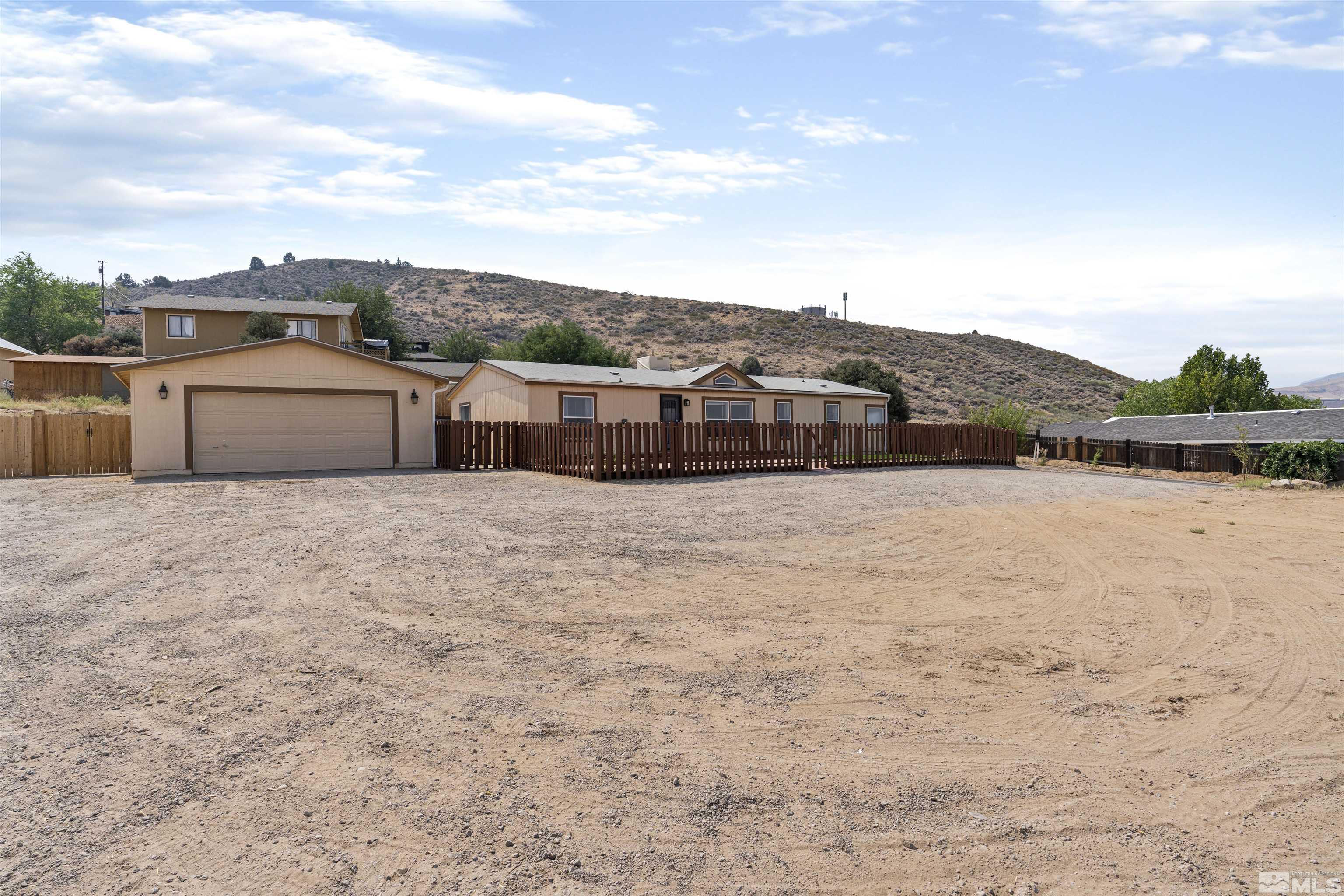 16000 Perlite Drive Reno, NV 89521 - Photo 2 of 29 a view of a lake with a mountain