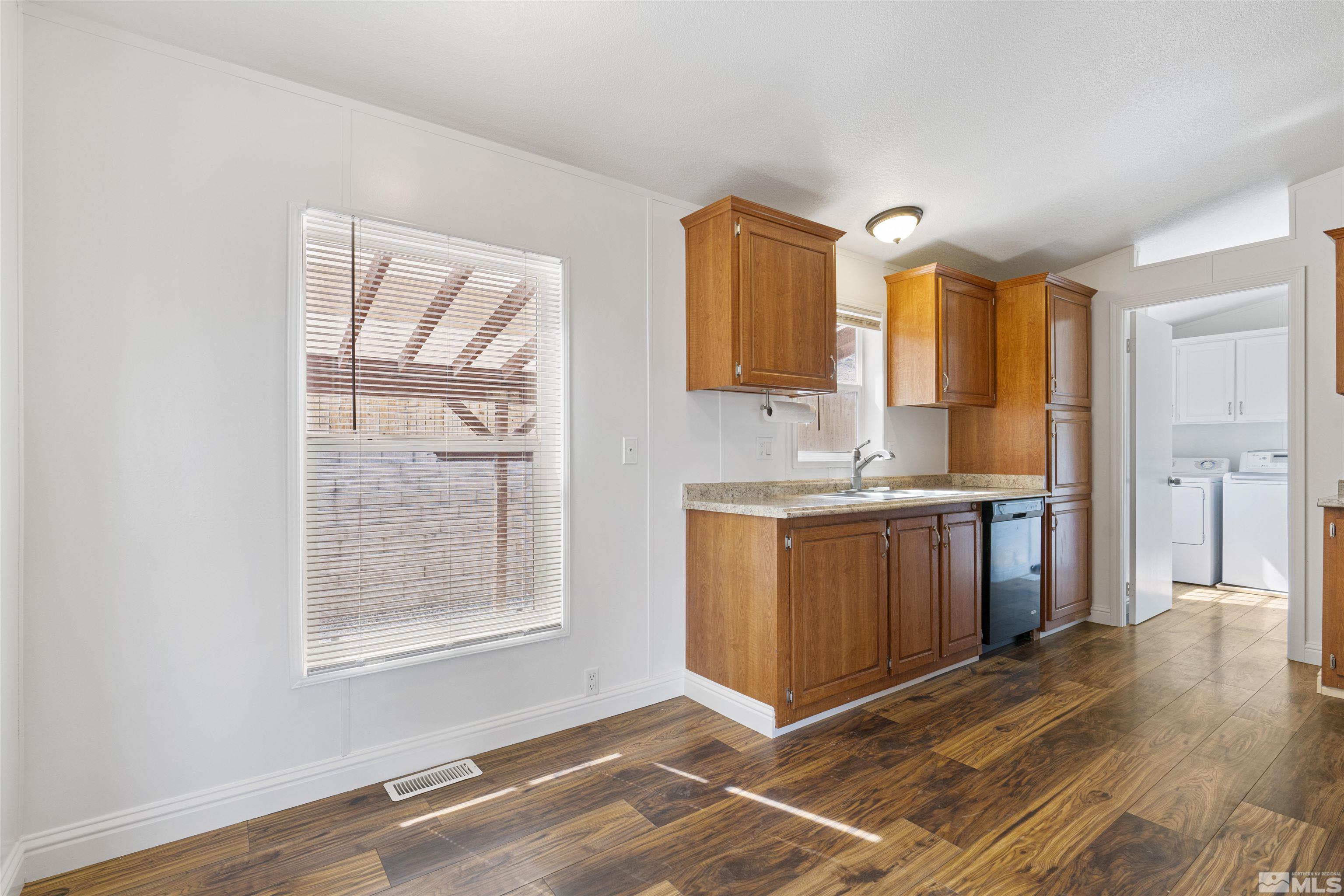 16000 Perlite Drive Reno, NV 89521 - Photo 5 of 29 a view of kitchen with wooden floor and cabinets