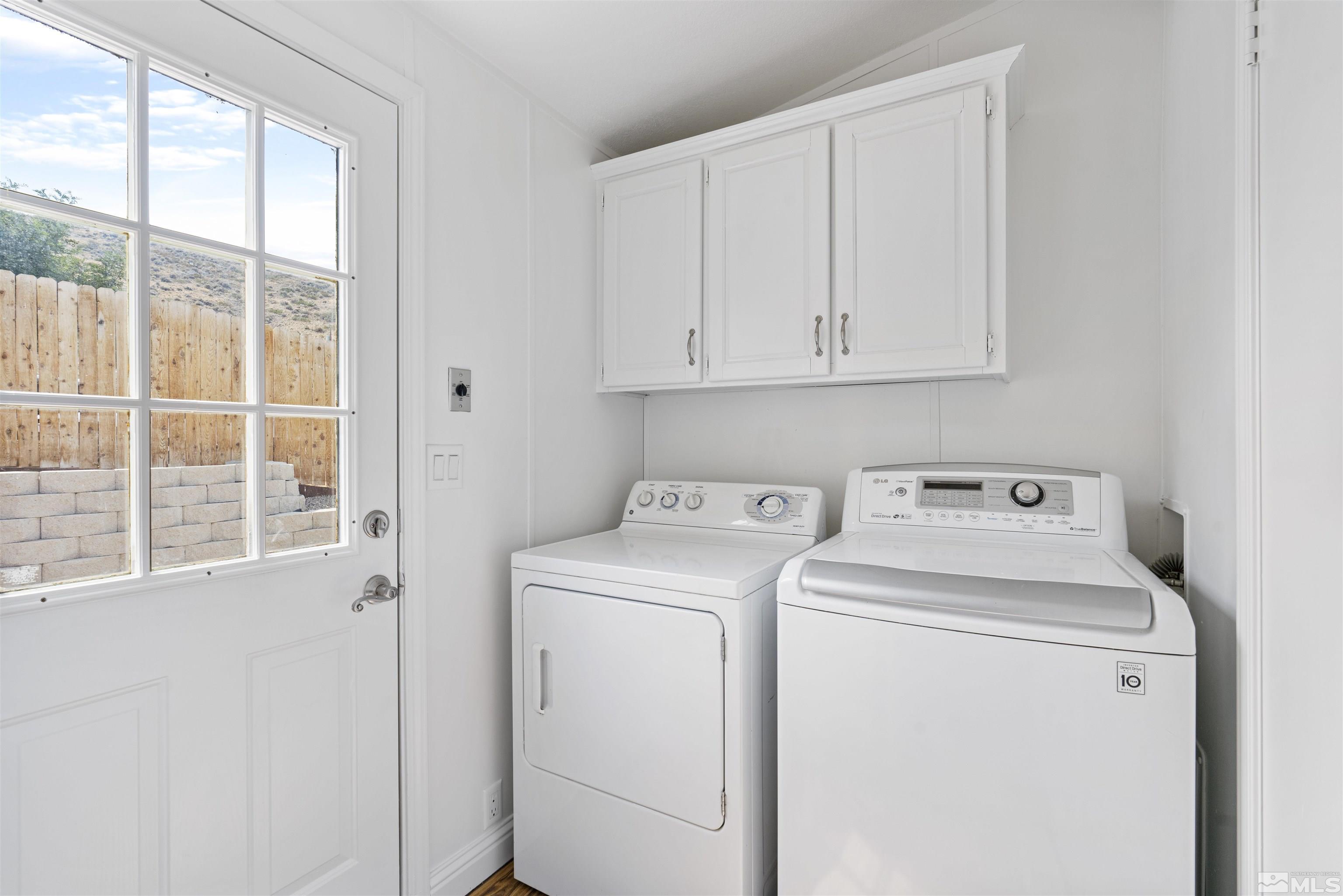 16000 Perlite Drive Reno, NV 89521 - Photo 9 of 29 a view of storage and utility room with washer and dryer