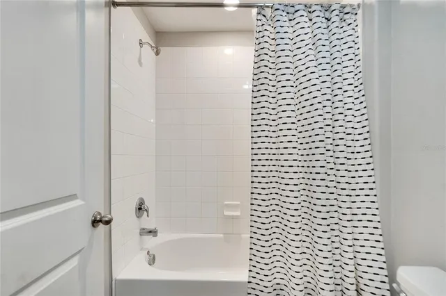 a view of a large body of water with a building in the background