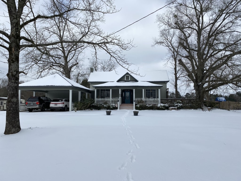 198 Fm 2974 Rd Center Center, TX 75935 - Photo 11 of 50 a front view of a house with yard covered in snow