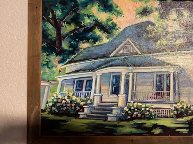 a picture of a bench in front of a house