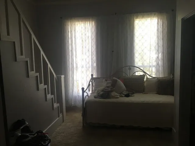 a kitchen with a table chairs stove and cabinets
