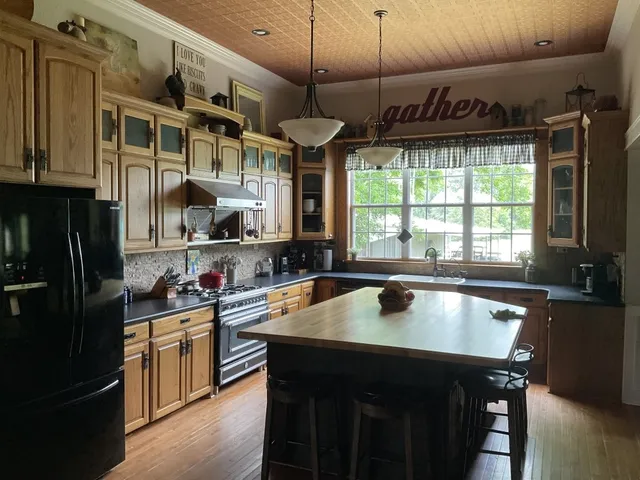 a dining table with chairs and wooden floor