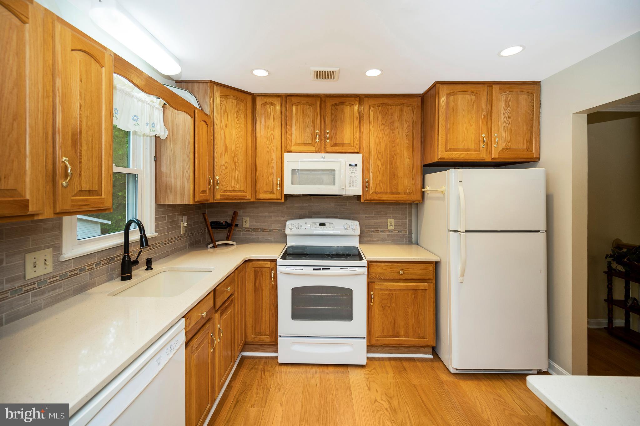 14 Apache Terrace Fredericksburg, VA 22401 - Photo 7 of 38 a kitchen with a refrigerator sink and cabinets
