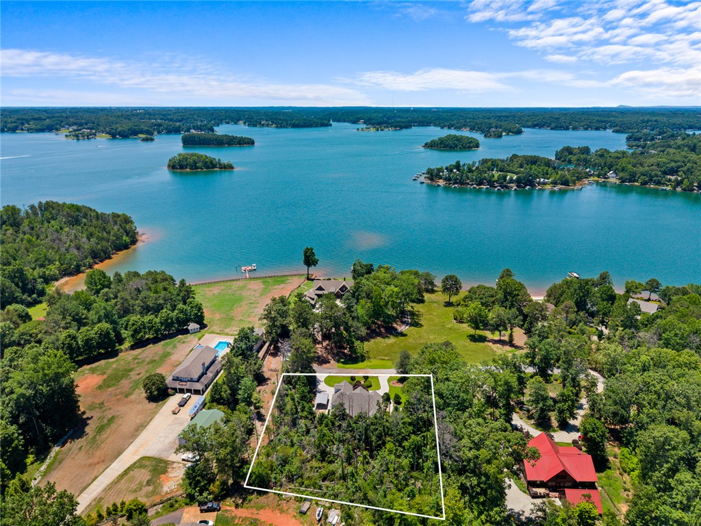 135 Sunset Bay Boulevard Seneca, SC 29672 - Photo 50 of 50 Perched above the lake, this property offers serene waterfront views with private dock access.
