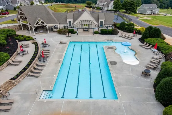 an aerial view of a house with swimming pool