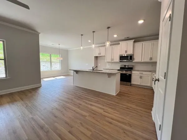 a view of kitchen with wooden floor
