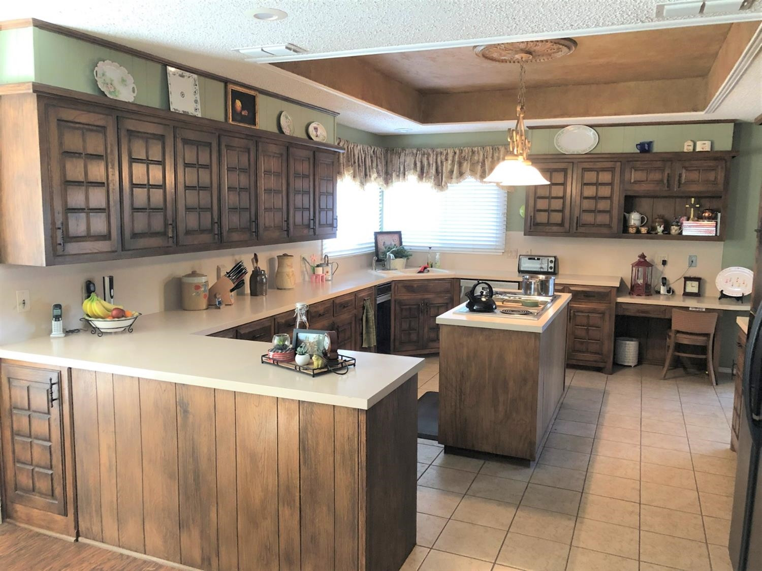 4018 88th Place Lubbock, TX 79423 - Photo 11 of 31 a kitchen with a sink a counter and cabinets