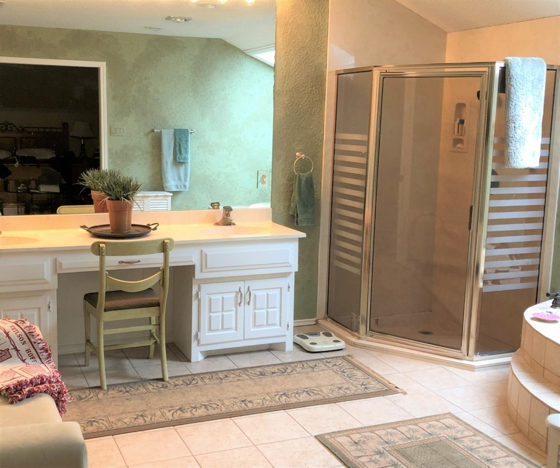 4018 88th Place Lubbock, TX 79423 - Photo 15 of 31 a bathroom with a sink a toilet and shower