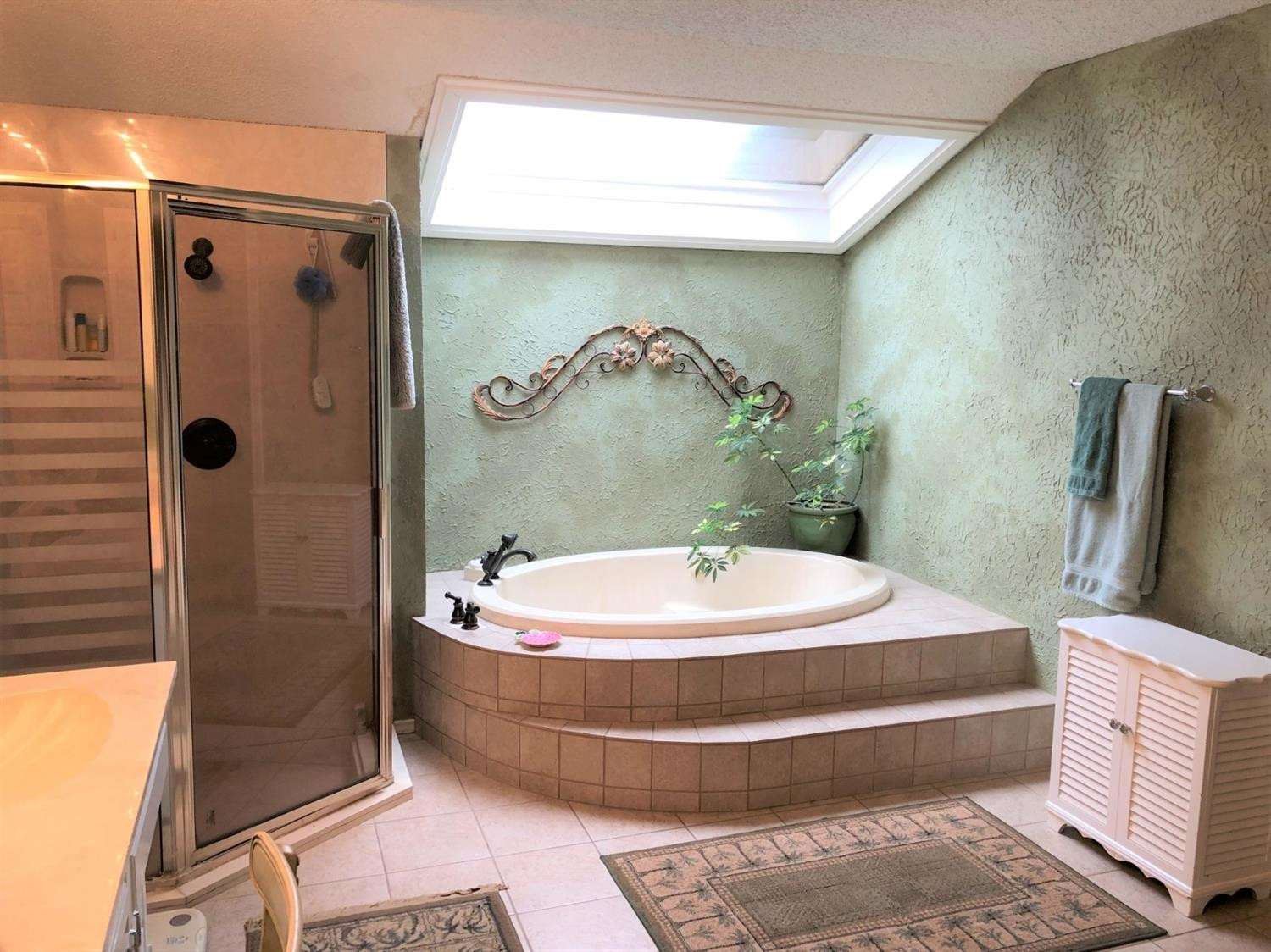 4018 88th Place Lubbock, TX 79423 - Photo 16 of 31 a bathroom with a tub and a shower