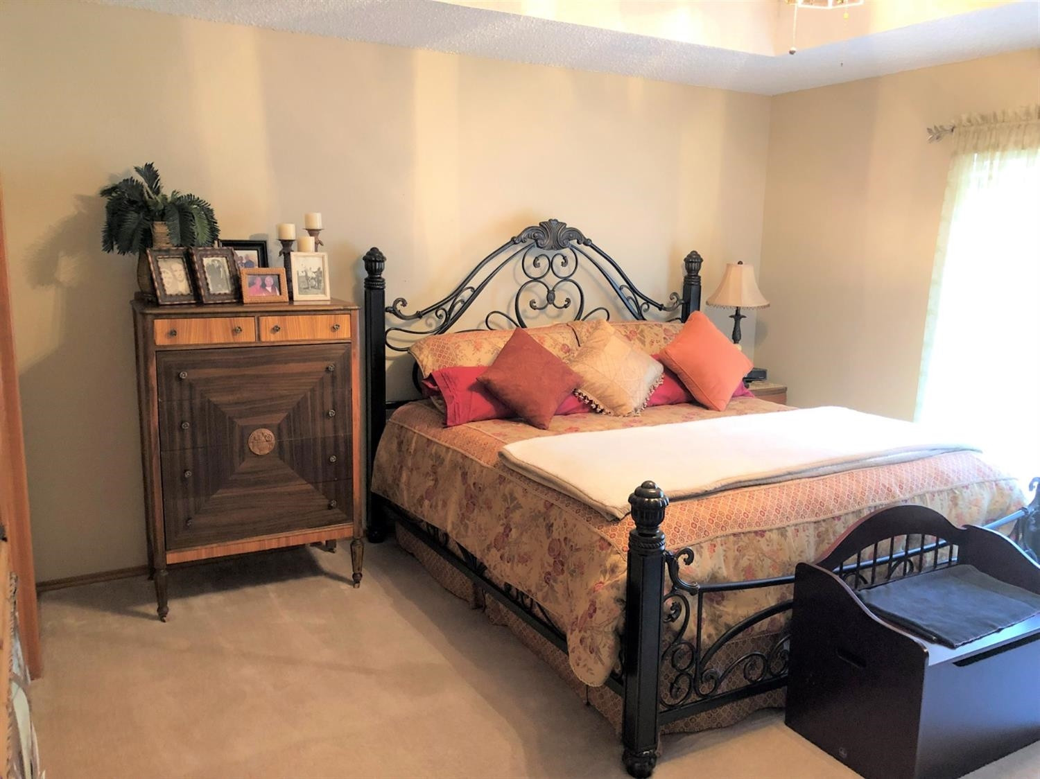 4018 88th Place Lubbock, TX 79423 - Photo 17 of 31 a bedroom with a bed and a lamp on the dresser