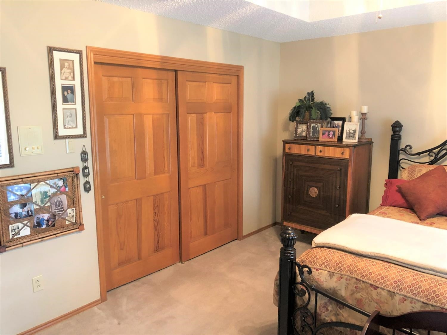 4018 88th Place Lubbock, TX 79423 - Photo 18 of 31 a bedroom with a bed and a cabinet