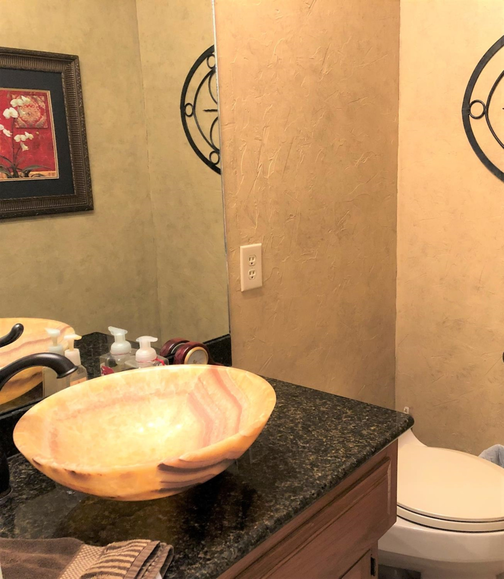 4018 88th Place Lubbock, TX 79423 - Photo 20 of 31 a bathroom with a sink and a mirror