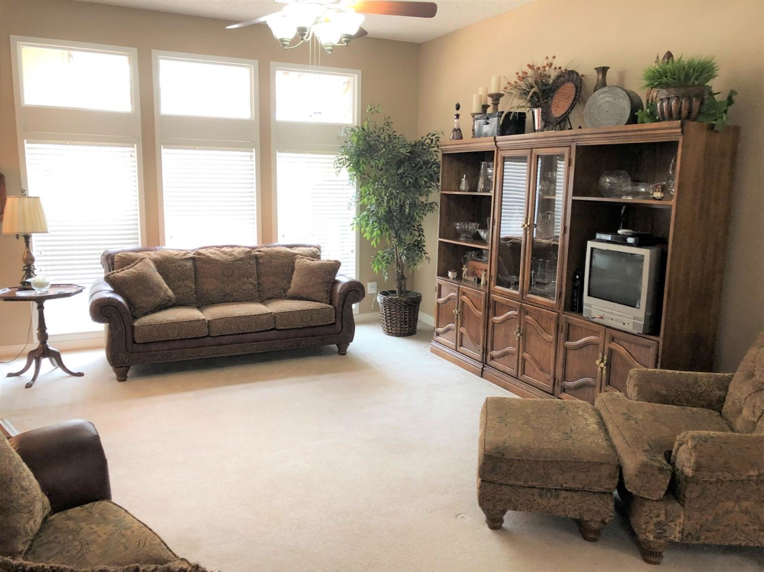 4018 88th Place Lubbock, TX 79423 - Photo 3 of 31 a living room with furniture a flat screen tv and a large window