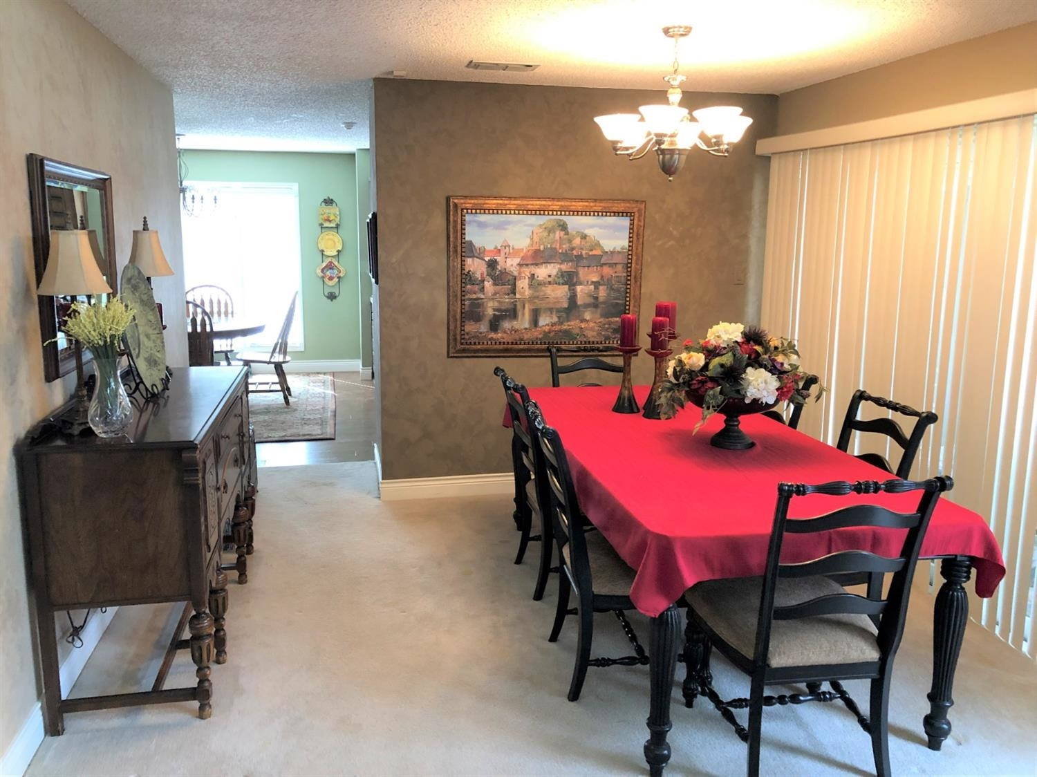 4018 88th Place Lubbock, TX 79423 - Photo 5 of 31 a view of a dining room with furniture and a chandelier