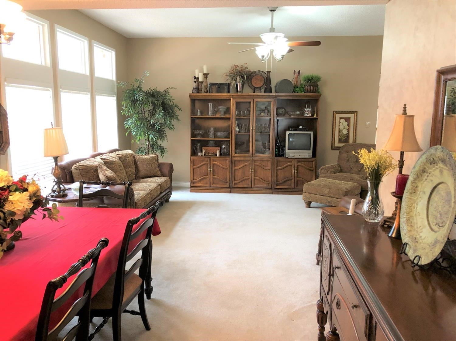 4018 88th Place Lubbock, TX 79423 - Photo 6 of 31 a living room with furniture and a flat screen tv