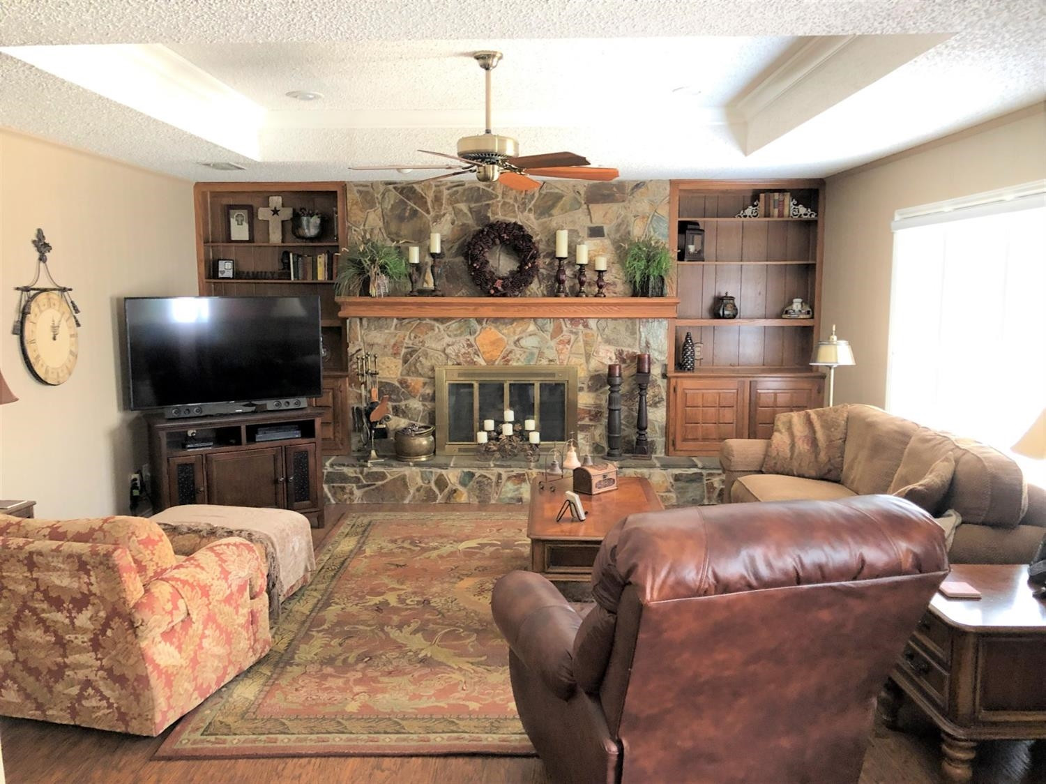 4018 88th Place Lubbock, TX 79423 - Photo 8 of 31 a living room with furniture and a flat screen tv