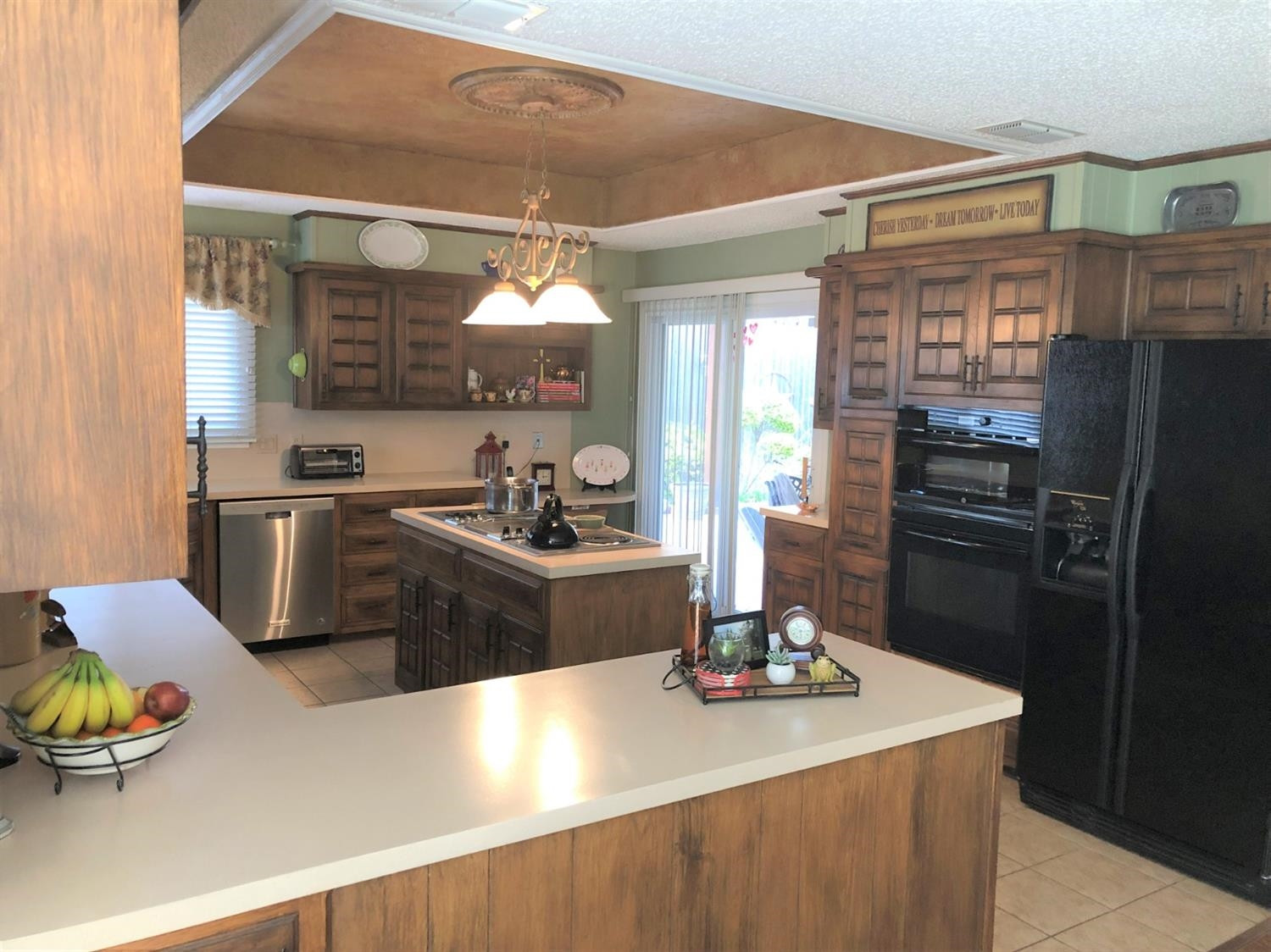 4018 88th Place Lubbock, TX 79423 - Photo 9 of 31 a kitchen with stainless steel appliances a sink stove and refrigerator