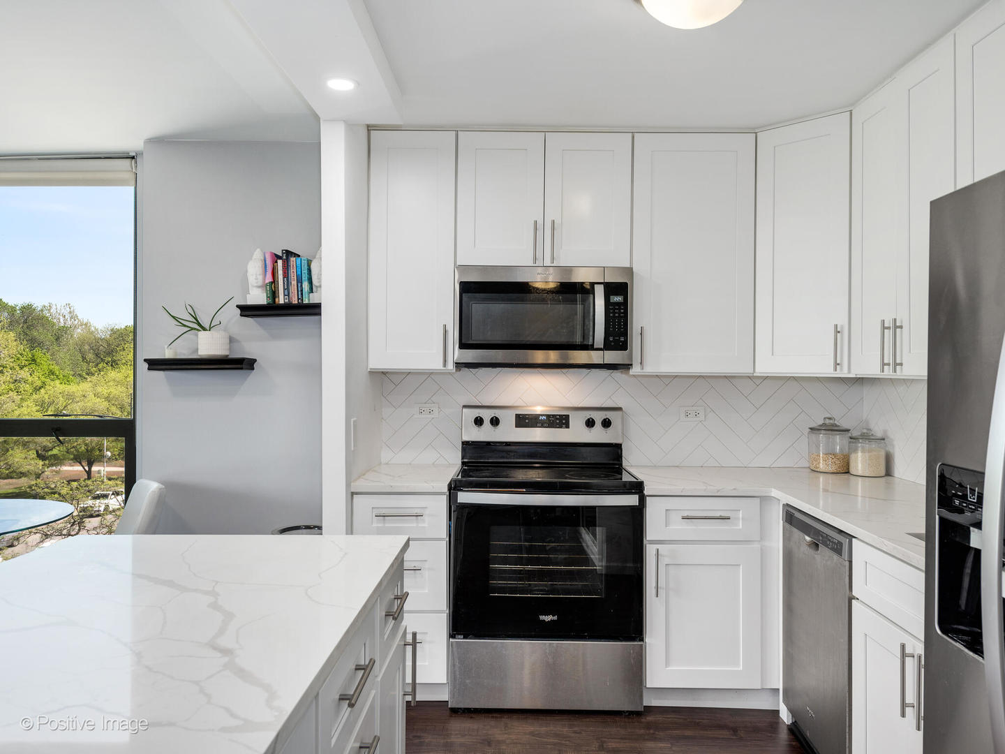 1850 North Clark Street, Unit 407 Chicago, IL 60614 - Photo 11 of 23 a kitchen with stainless steel appliances a stove a sink and a refrigerator