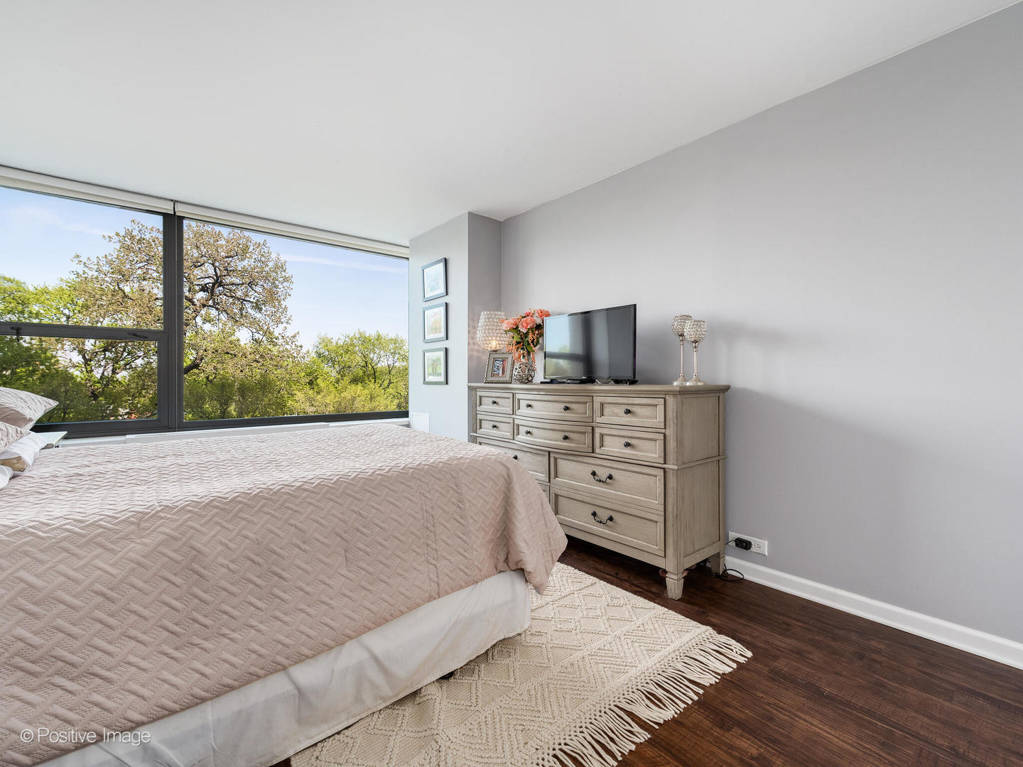 1850 North Clark Street, Unit 407 Chicago, IL 60614 - Photo 14 of 23 a bed room with a bed and a television