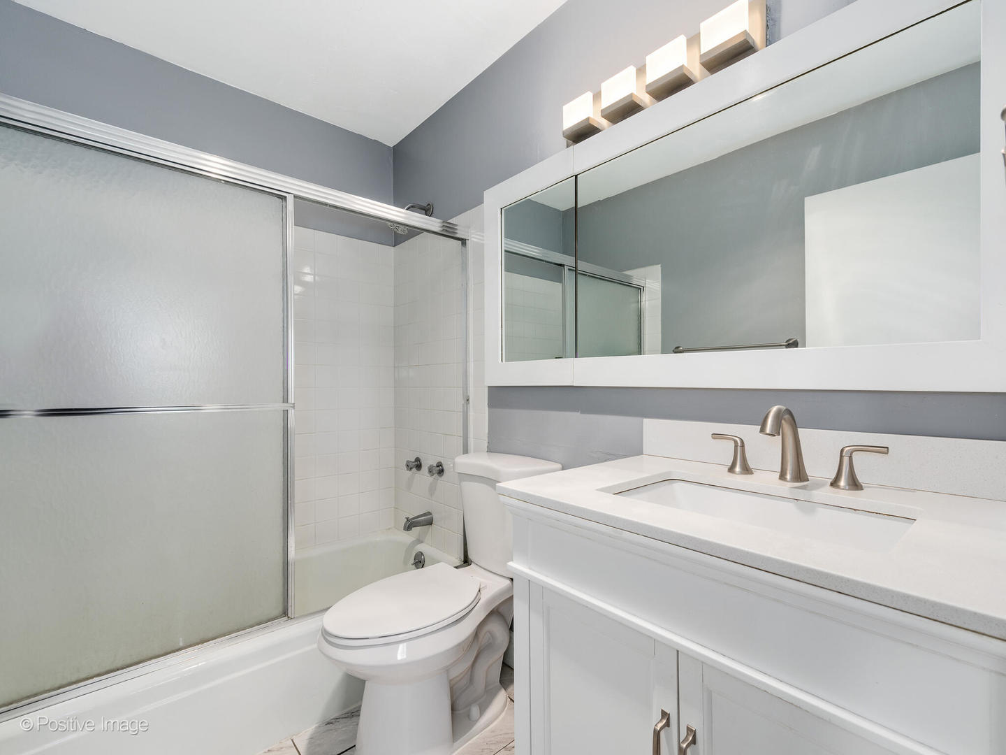 1850 North Clark Street, Unit 407 Chicago, IL 60614 - Photo 16 of 23 a bathroom with a sink a toilet and shower