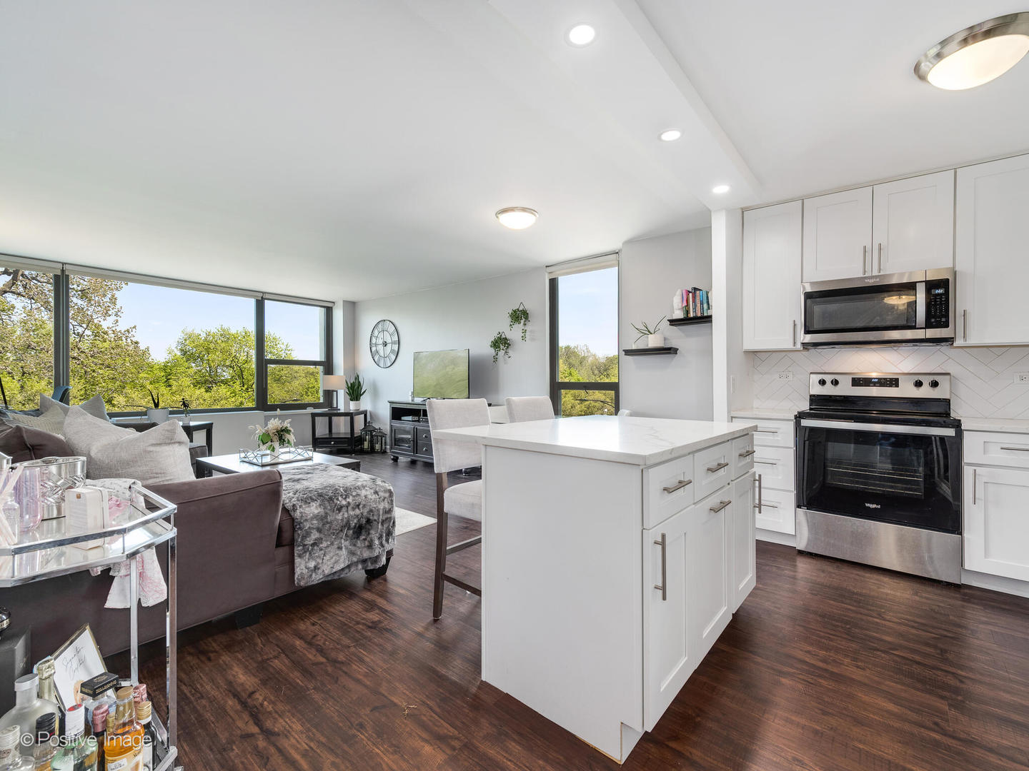 1850 North Clark Street, Unit 407 Chicago, IL 60614 - Photo 2 of 23 a kitchen that has a lot of cabinets a sink and appliances in it