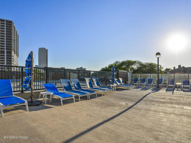 1850 North Clark Street, Unit 407 Chicago, IL 60614 - Photo 21 of 23 a view of chairs and tables in the patio
